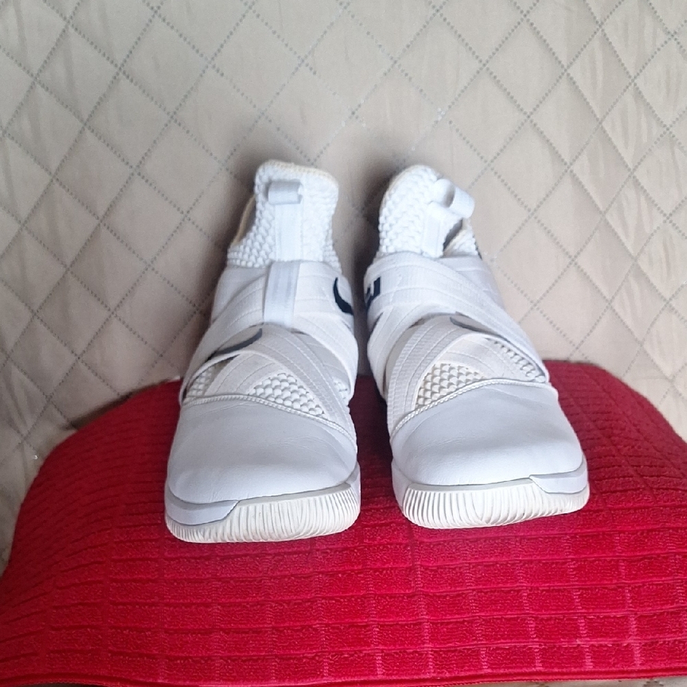 White Nike Lebron Soldier 12 With Laces Up Straps That Have Velcro.